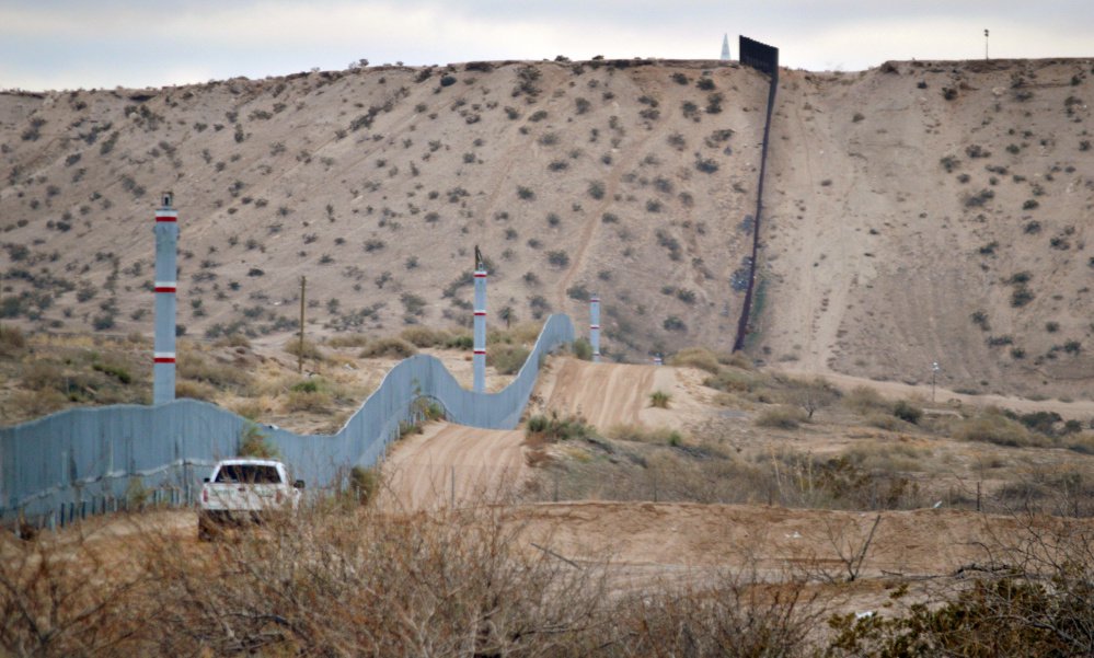 A U.S. Border Patrol agent drives near the U.S.-Mexico border fence in Sunland Park, N.M. 
