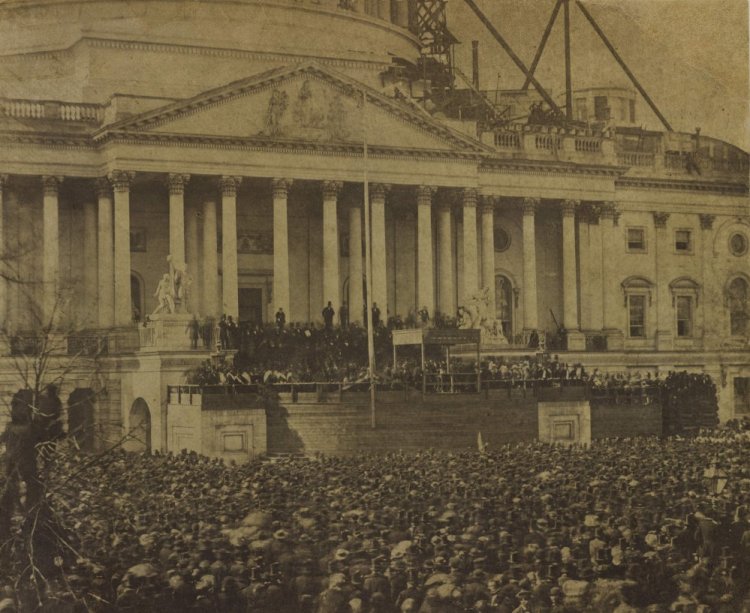 This photograph of the first inauguration of Abraham Lincoln taken on March 4, 1861, is attributed to photographer Alexander Gardner. The Capitol dome in Washington, D.C., was only partially built at the time.