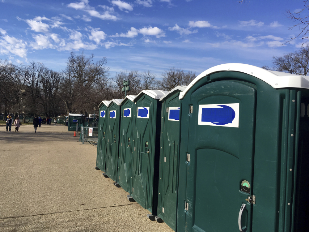 A row of portable restrooms, with the name Don's Johns covered up, is seen on Capitol Hill in Washington on Friday. The Virginia-based company says it provides portable restrooms for many Washington-area events.