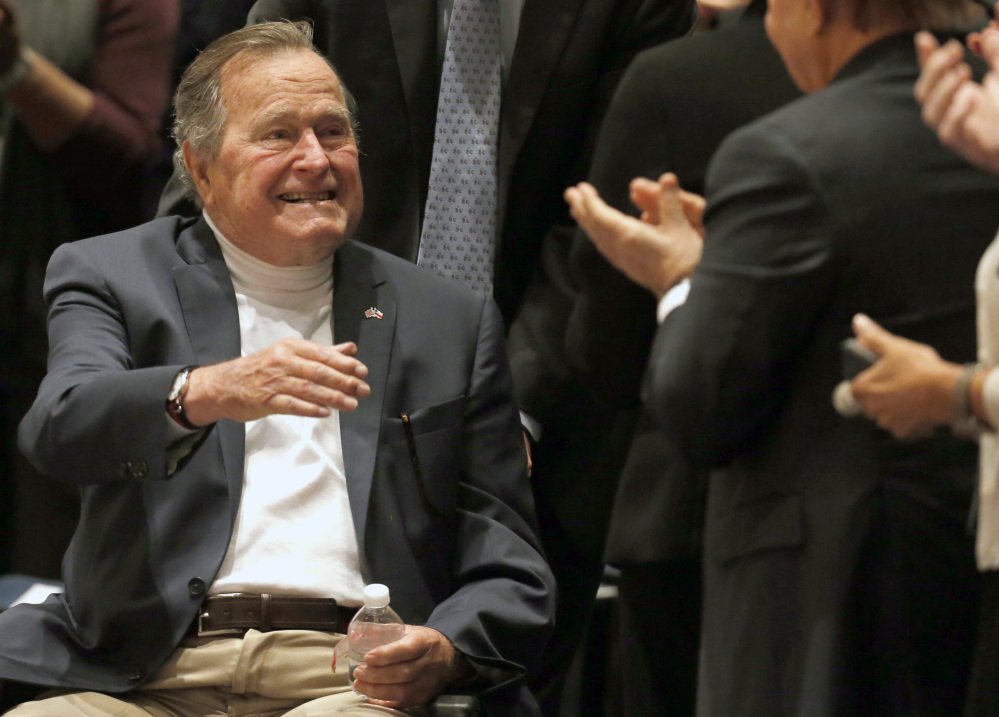 Former President George H.W. Bush, shown acknowledging the crowd at his presidential library in 2014, was released from a Houston hospital Monday after a two-week stay for treatment of pneumonia.