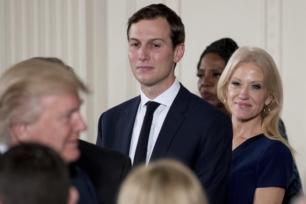 White House Senior Advisor Jared Kushner and Counselor to the President Kellyanne Conway watch as President Trump congratulates other senior staff during a swearing-in ceremony in the East Room of the White House on Sunday in Washington. 