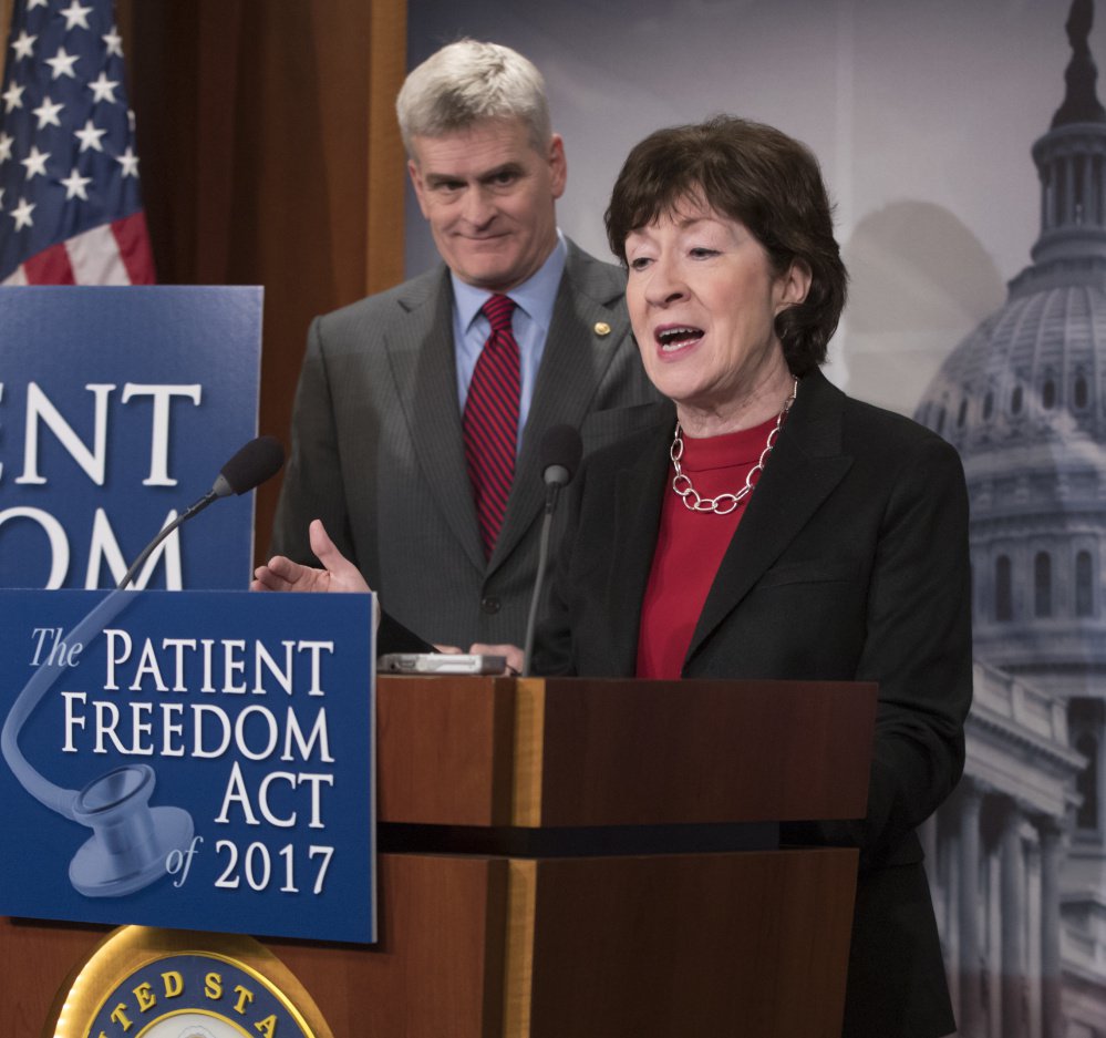 Sen. Bill Cassidy, R-La., listens on Jan. 23 as Maine Sen. Susan Collins discusses her Affordable Care Act replacement plan.