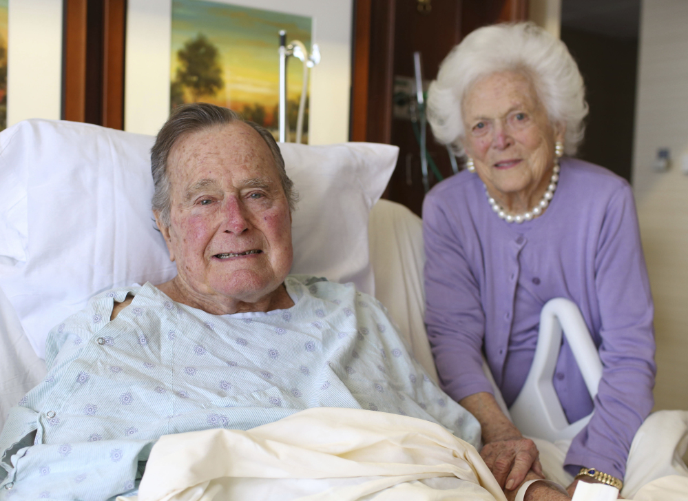 Former President George H.W. Bush and his wife, Barbara, pose for a photo at Houston Methodist Hospital in Houston. The 92-year-old former president is still suffering from pneumonia, but is well enough to leave the intensive care unit.