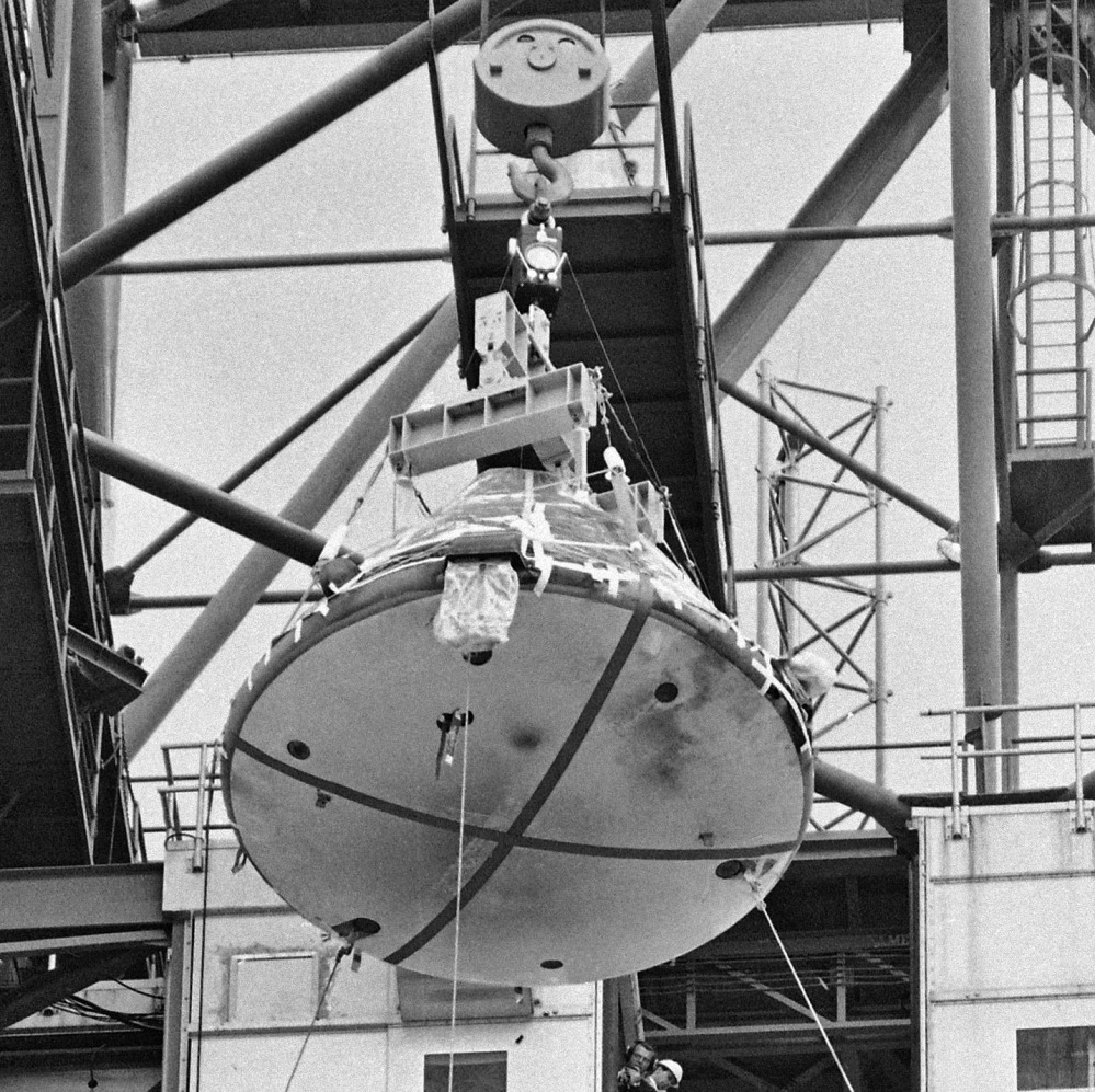 The Apollo 1 capsule, with black smudge marks visible on the heat shield, is transported at Cape Kennedy, Fla., in February 1967 after a fire on the launch pad killed three astronauts.