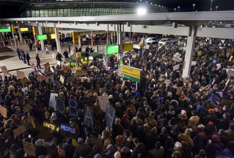 Protesters assemble at John F. Kennedy International Airport in New York, Saturday, Jan. 28, 2017 after earlier in the day two Iraqi refugees were detained while trying to enter the country. On Friday, Jan. 27, President Donald Trump signed an executive order suspending all immigration from countries with terrorism concerns for 90 days. Countries included in the ban are Iraq, Syria, Iran, Sudan, Libya, Somalia and Yemen, which are all Muslim-majority nations.