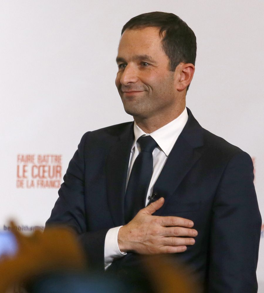 Candidate for the French left's presidential primaries Benoit Hamon greets supporters after winning the Socialist Party presidential nomination Sunday.