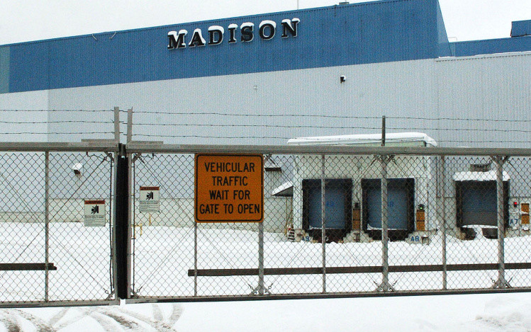 Gates are closed and locked Tuesday at the closed former Madison Paper Industries mill, where new owners hope to redevelop a portion of the property.