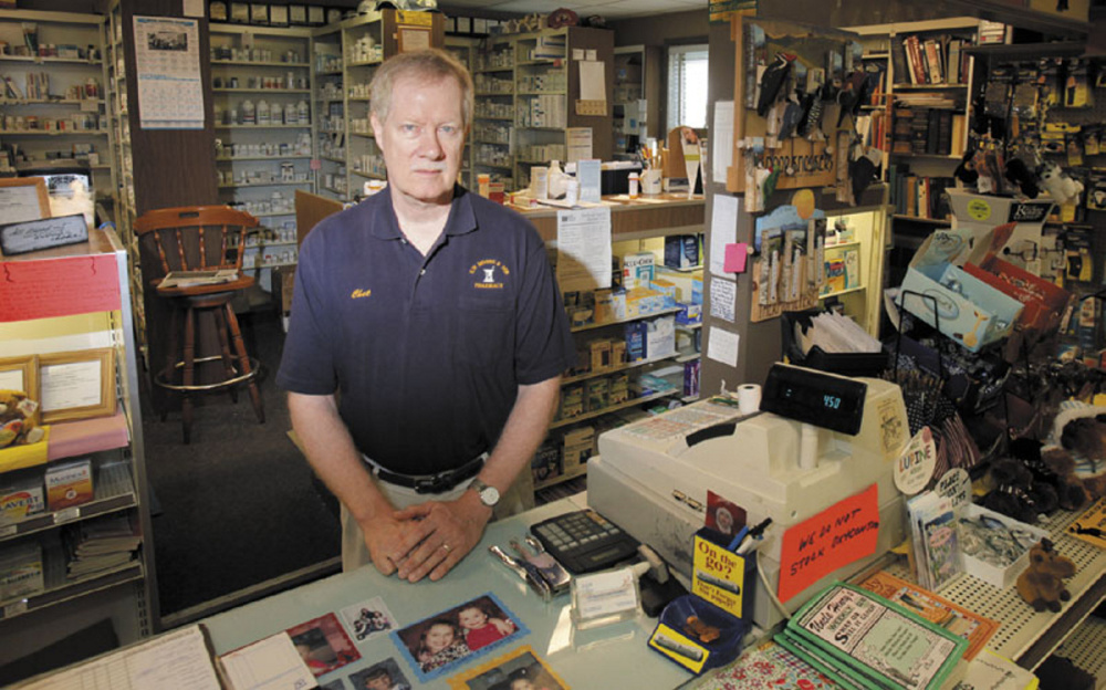 Chester Hibbard, owner and pharmacist at the E.W. Moore & Sons Pharmacy in Bingham, put up signs saying the pharmacy no longer stocked OxyContin after it was robbed twice — once in 2006 and then in 2010. The signs didn't prevent another robbery, though, that happened just hours after this photo was taken in 2011. James Stile, of Sangerville, was convicted of armed robbery in connection with the 2011 case.