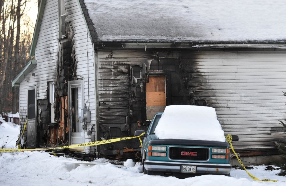 A house at 323 Norridgewock Road in Fairfield, seen Sunday, shows the damage that resulted when Terry Whitney set fire to the home of his estranged wife Dec. 25 before fatally stabbing himself.