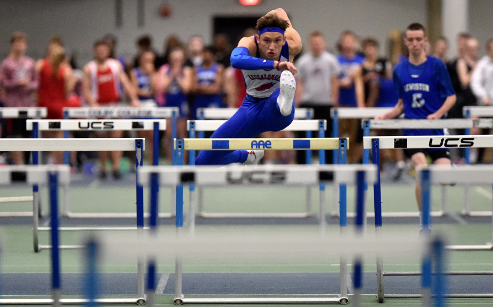 Messalonskee runner Tanner Burton competes in the 55-meter hurdles during a Dec. 10 meet at Colby College.