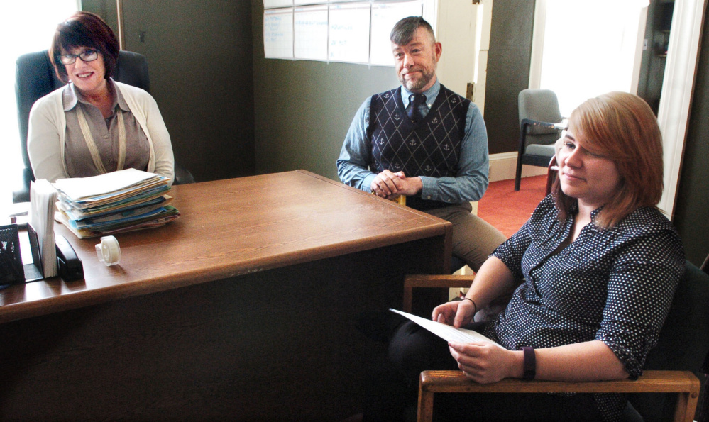 Diane Bryan, outgoing executive director of the Waterville Opera House, left; Nathan Towne, marketing director for Waterville Creates!; and the opera house's new executive director, Tamsen Brooke Warner, discuss changes at the organization on Monday.