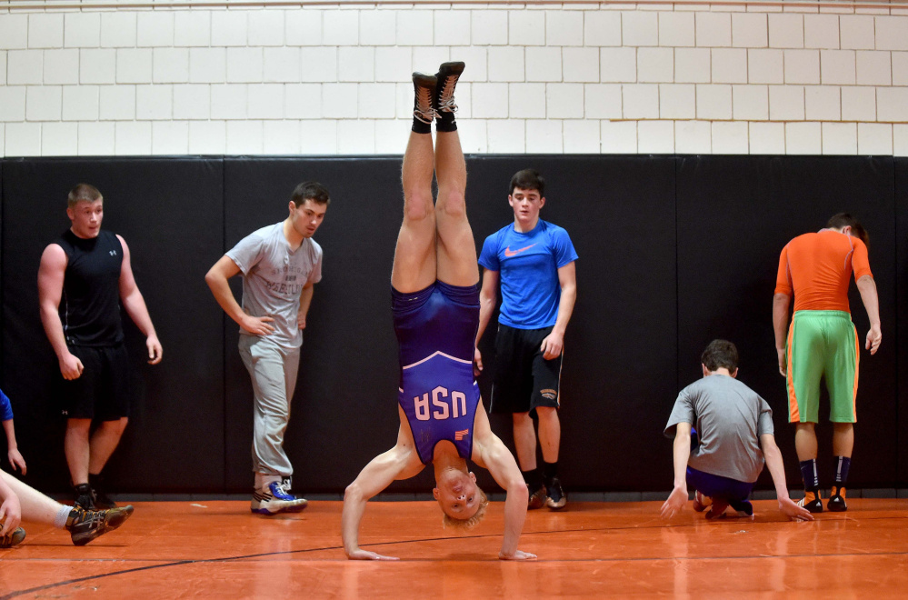 Cooper Holland works out during a recent Skowhegan wrestling practice.