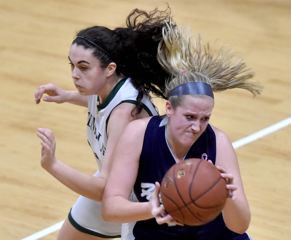 Temple's Kiara Carr, left, closes in on Highview Christian's Grace Rossignol during a Class D South game Friday afternoon in Waterville.