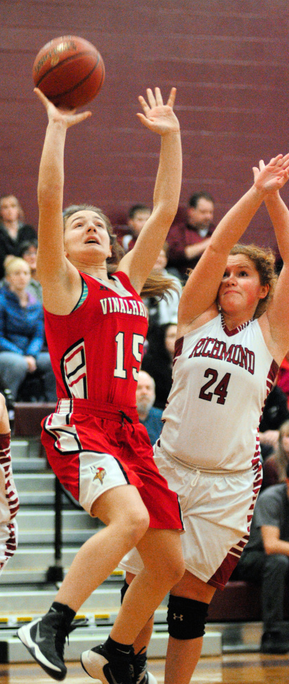 Vinalhaven's Deja Doughty, left, shoots as Richmond's Cassidy Harriman defends during a game Friday at Richmond High School.