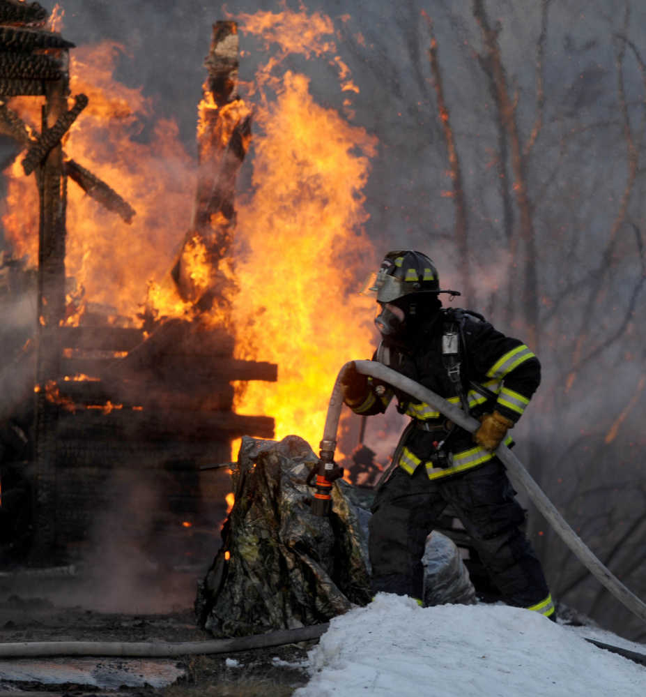 Firefighters from several area fire departments battle a house fire Jan. 13 on China Road in Winslow.