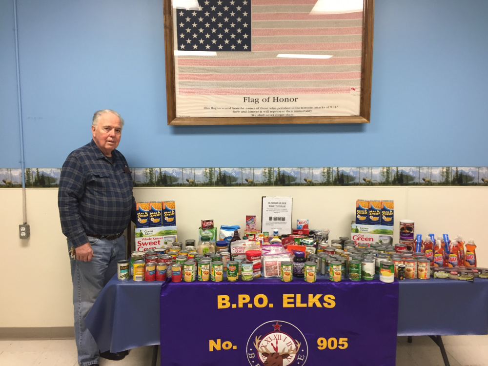 Waterville Elks Lodge 905 Exhaulted Ruler Lanni White with the donations made during the Waterville Elks Dick Willette Memorial Food Drive at Waterville Elks Lodge 905.
