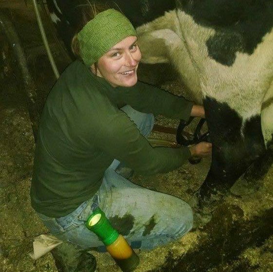 Sarah Smith of Grassland Organic Farm in Skowhegan gets ready to milk a cow in a recent photo. Smith, the former manager of the Skowhegan Farmers' Market, will be among the speakers Jan. 29 at the annual Maine Farmers Market Convention.