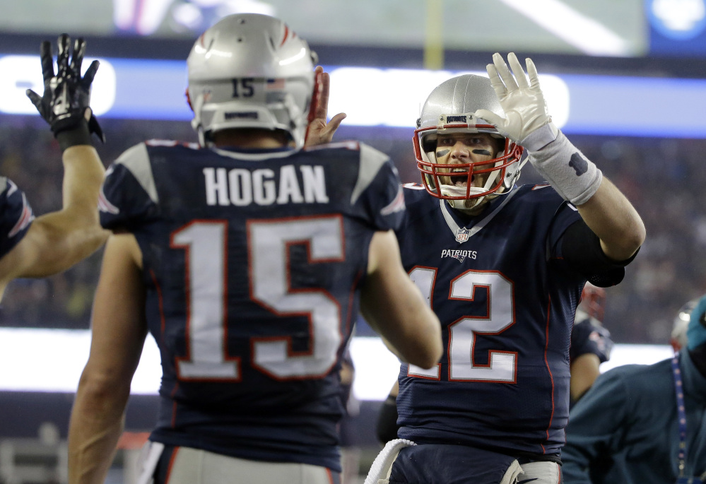 New England Patriots quarterback Tom Brady (12) celebrates with wide receiver Chris Hogan (15) after a touchdown pass against the Pittsburgh Steelers during the first half of the AFC championship game Sunday in Foxborough, Massachusetts.