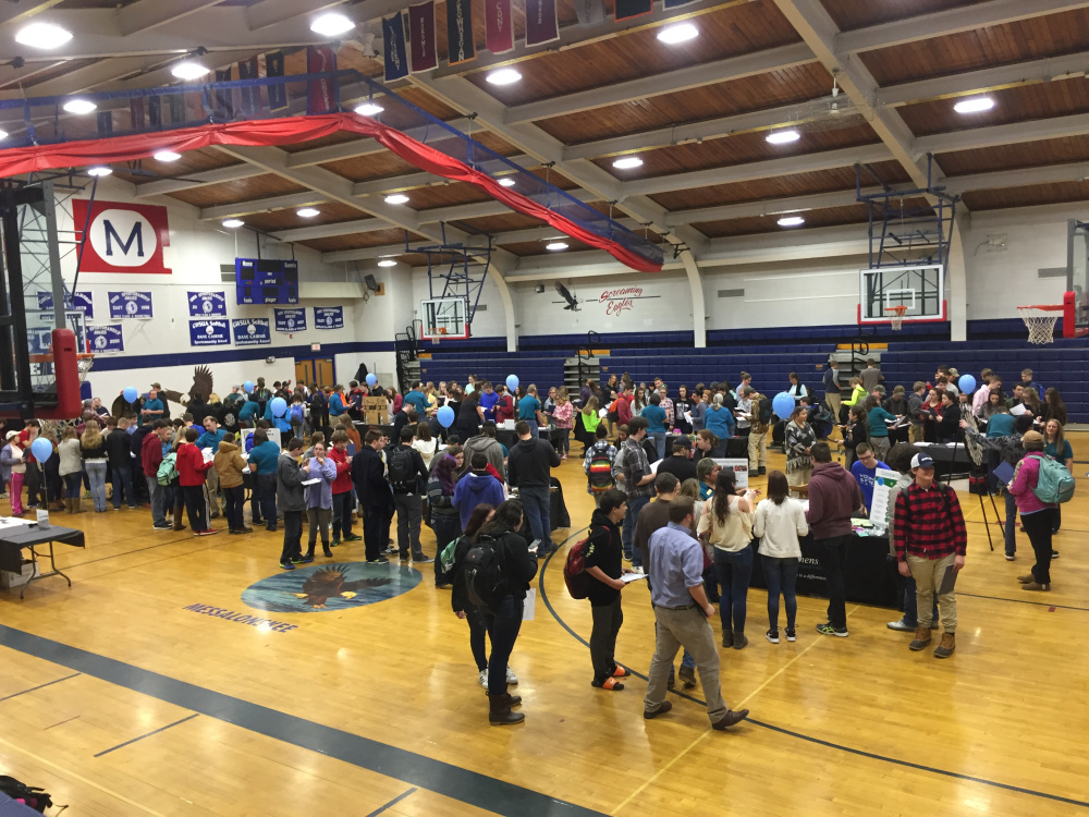 The Messalonskee High School gymnasium is full of students during the Financial Fitness Fair 2017.