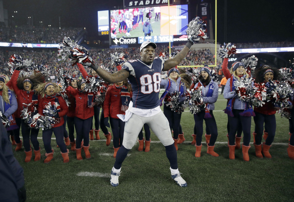 New England Patriots tight end Martellus Bennett celebrates with cheerleaders after the AFC championship game against the Pittsburgh Steelers on Jan. 22 in Foxborough, Massachusetts. Bennett has filled Rob Gronkowski's shoes in more ways than one.