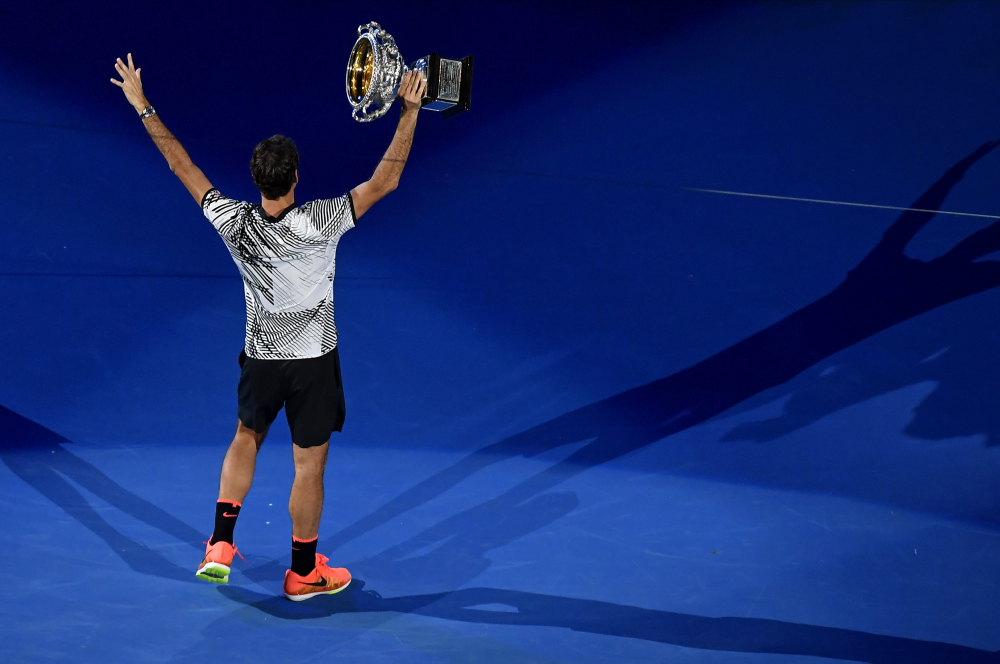 Roger Federer holds his trophy after defeating Rafael Nadal during the men's singles final at the Australian Open on Sunday in Melbourne, Australia.