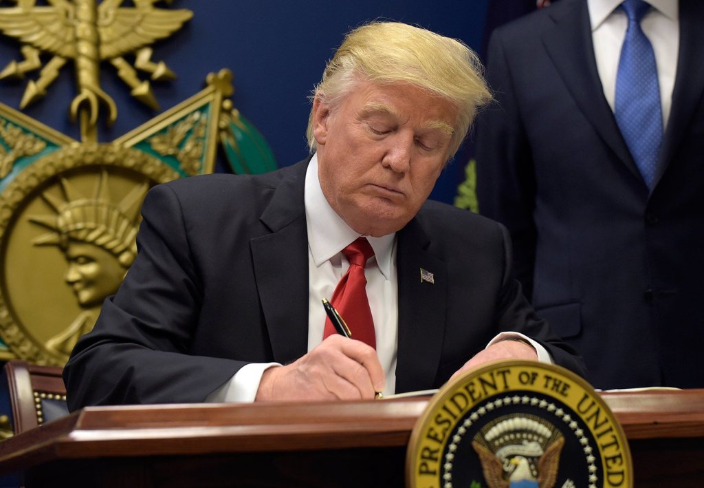 President Trump signs an executive order Friday for "extreme vetting" of potential refugees from predominantly Muslim nations.