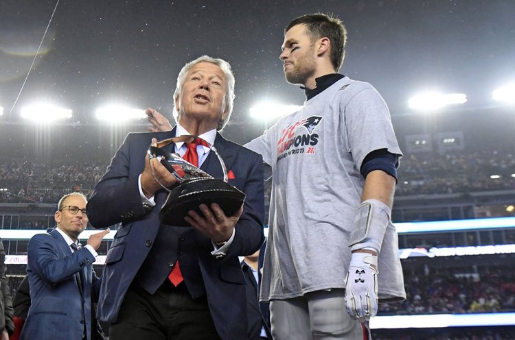 New England Patriots owner Robert Kraft and quarterback Tom Brady with the Lamar Hunt Trophy after beating the Pittsburgh Steelers Sunday in the 2017 AFC Championship Game at Gillette Stadium. Brady has repeatedly to signed contracts or restructured  them to give the Patriots flexibility to sign other players.