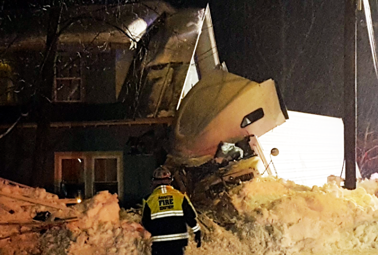 Part of Route 4 in Farmington was closed Tuesday night after a tractor-trailer slid off icy pavement and hit a house.