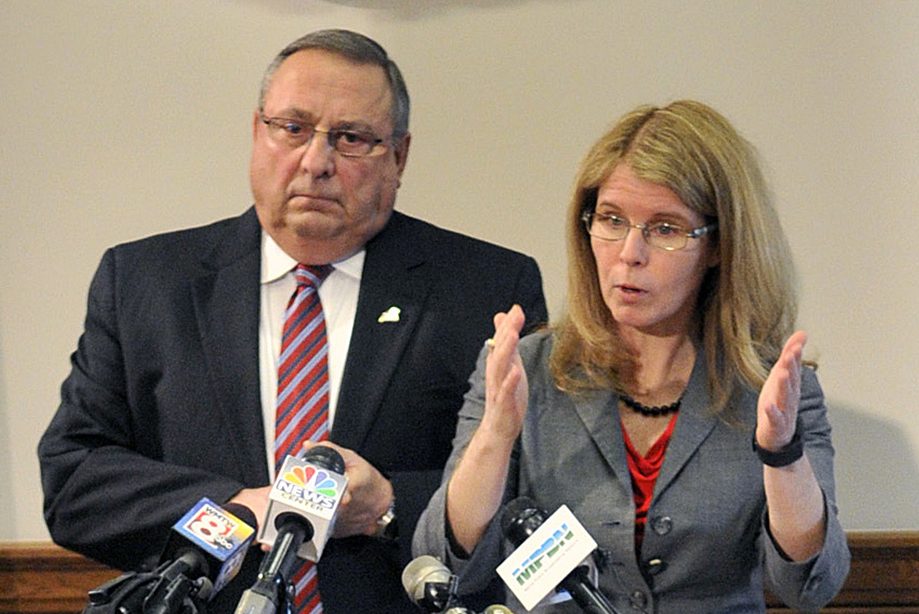 Gov. Paul LePage and Health and Human Services Commissioner Mary Mayhew, seen in 2015, are seeking federal approval for the state to charge premiums and co-pays to MaineCare recipients who are able to earn income.
