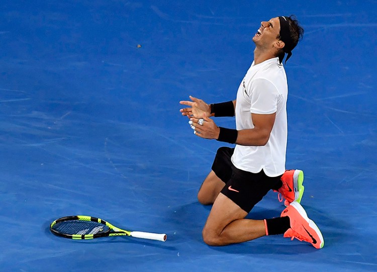 Spain's Rafael Nadal celebrates after defeating Bulgaria's Grigor Dimitrov during their semifinal at the Australian Open tennis championships in Melbourne, Australia, early Saturday, Jan. 28, 2017. (AP Photo/Andy Brownbill)