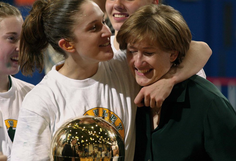 Staff photo Number 3 Sarah Marshall and Coach Elizabeth Rickett with gold ball celebration after winning state class A champ. "Obviously, it makes my job easy when your best player is also your hardest worker," Rickett said.