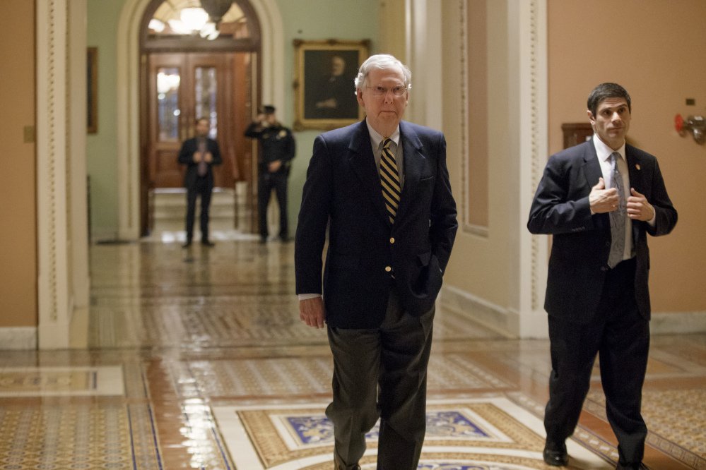 Senate Majority Leader Mitch McConnell of Kentucky arrives on Capitol Hill in Washington early Friday. McConnell on Sunday offered a broader critique of President Trump's executive order than he had previously.