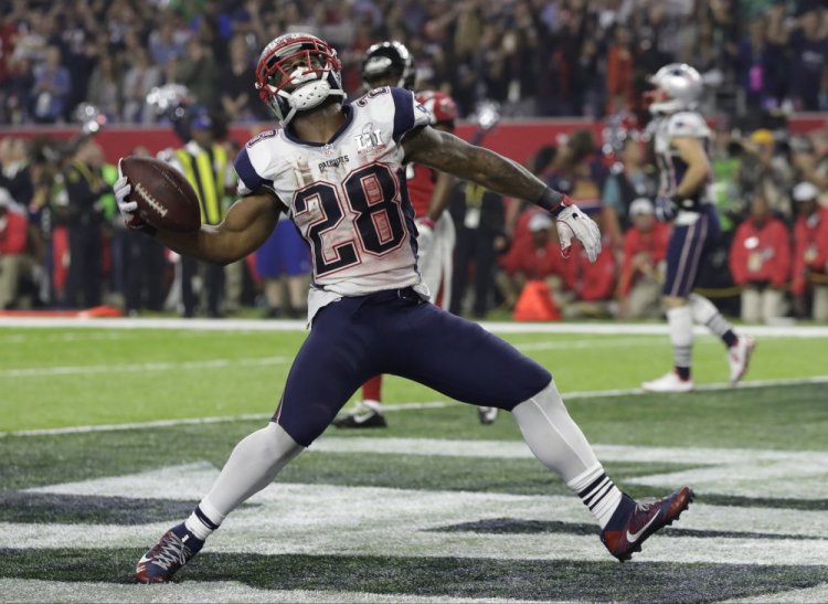 New England Patriots' James White celebrates after scoring a touchdown during the second half of the Super Bowl.