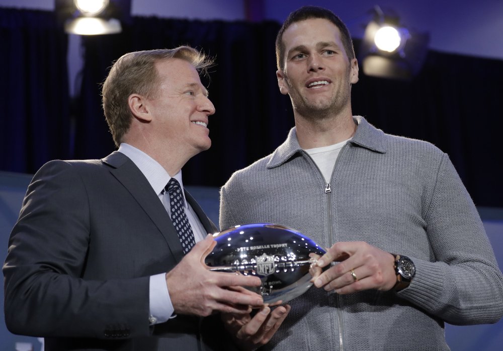 Patriots fans were looking forward to this moment, when NFL Commissioner Roger Goodell, left, handed Tom Brady the Super Bowl MVP trophy. Goodell suspended Brady for four games to start the season, yet the two were cordial in their meeting Monday.