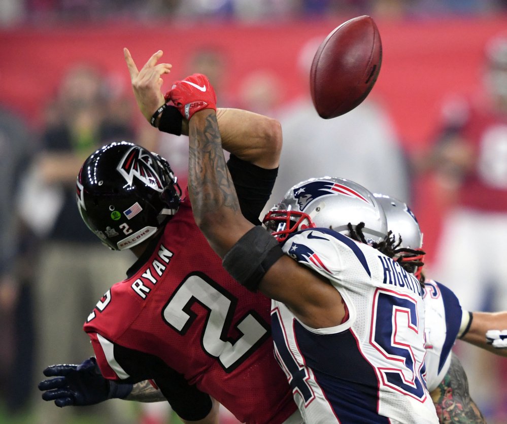 Patriots linebacker Dont'a Hightower sacks Falcons quarterback Matt Ryan, causing a crucial late-game fumble that set up a New England touchdown.