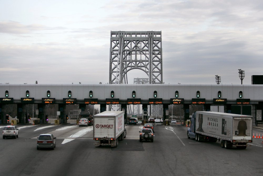 Trucks approach the toll booth at the George Washington bridge in Fort Lee, N.J. Many of those drivers have racked up thousands of dollars in unpaid tolls and related fees that can lead to theft and other criminal charges.