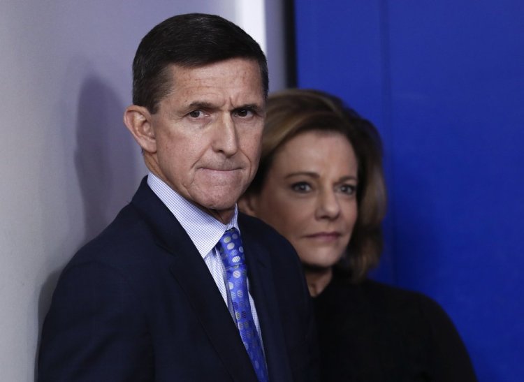 National Security Adviser Michael Flynn stands with K.T. McFarland, deputy national security adviser, at a news briefing at the White House this month. He resigned Monday night amid controversy over his discussions with a Russian ambassador.
