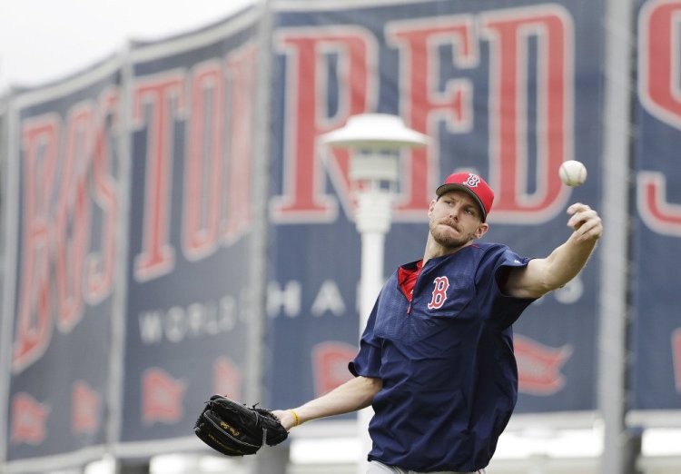 Red Sox pitcher Chris Sale throws during a spring training workout Monday in Fort Myers, Fla. One question is whether he will follow other big-name pitchers' tendency to fall short of expectations in their first season in Boston.