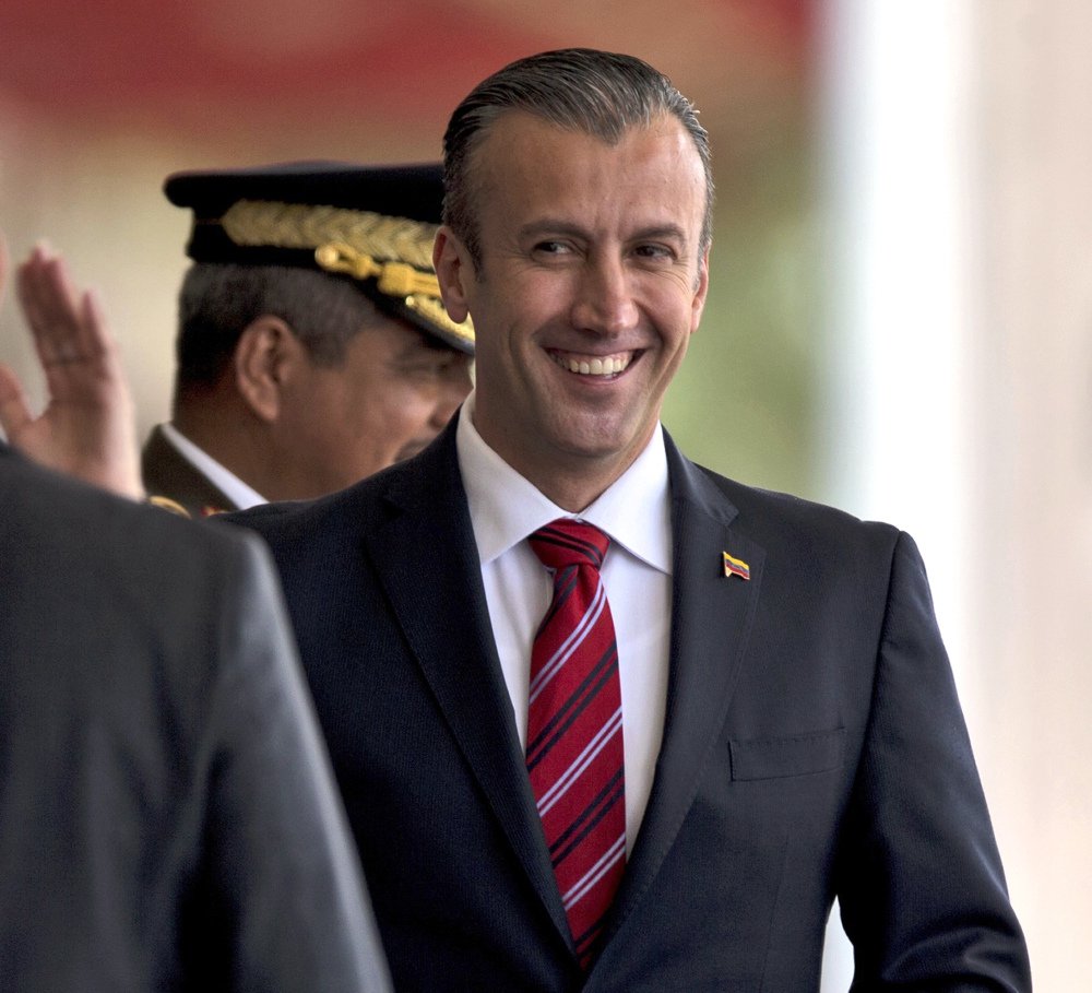 FILE - In this Feb. 1, 2017 photo, Venezuela's Vice President Tareck El Aissami, right, is saluted by Boilivarian Army officer upon his arrival for a military parade at Fort Tiuna in Caracas, Venezuela. The administration of President Donald Trump is slapping sanctions on El Aissami and accusing him of playing a major role in international drug trafficking. That's according to individuals briefed on the U.S. government's plans who requested anonymity to disclose the move ahead of a formal announcement. (AP)