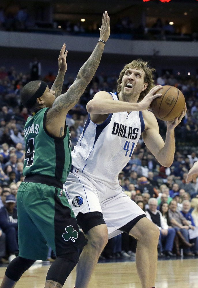 Mavericks forward Dirk Nowitzki, with a big height advantage, looks to shoot against Isaiah Thomas in the first half of Monday night's game in Dallas.