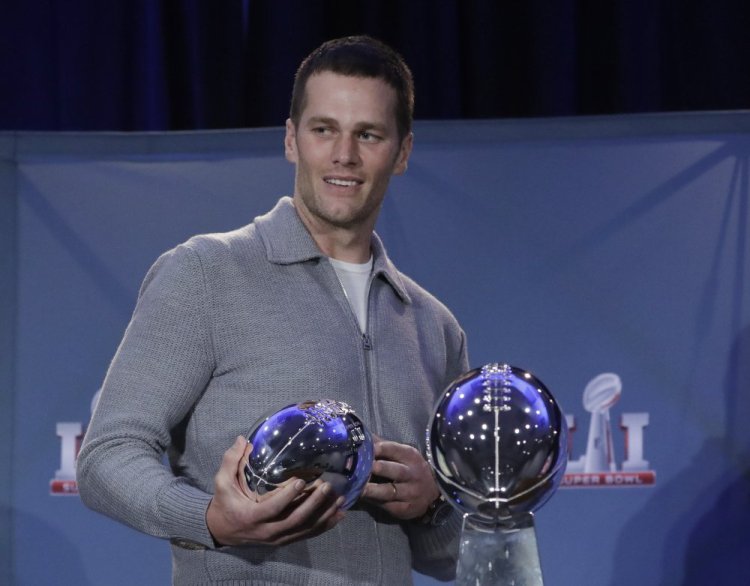 New England Patriots quarterback Tom Brady walks off with his MVP trophy after Super Bowl 51 this month. Zoo Atlanta announced Monday that it named a baby cockroach after Brady, part of a Super Bowl bet with a Rhode Island zoo.
