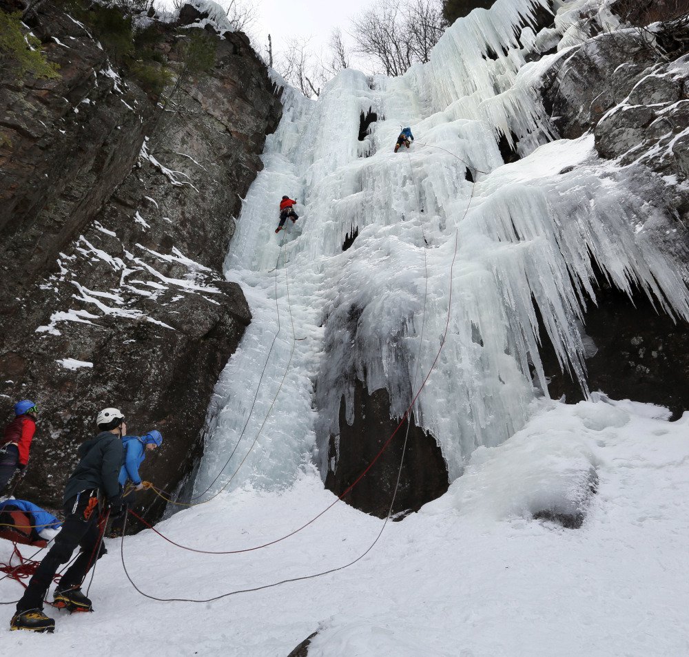 Two climbers ascend Frankenstein Cliff's "Dracula" on Feb. 6. Ice climbing presents puzzle-solving challenges that appeal to engineers like himself, Monjak says.