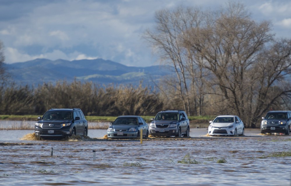 A flooded Interstate 5 snarls traffic for miles in Maxwell, Calif., on Saturday. 