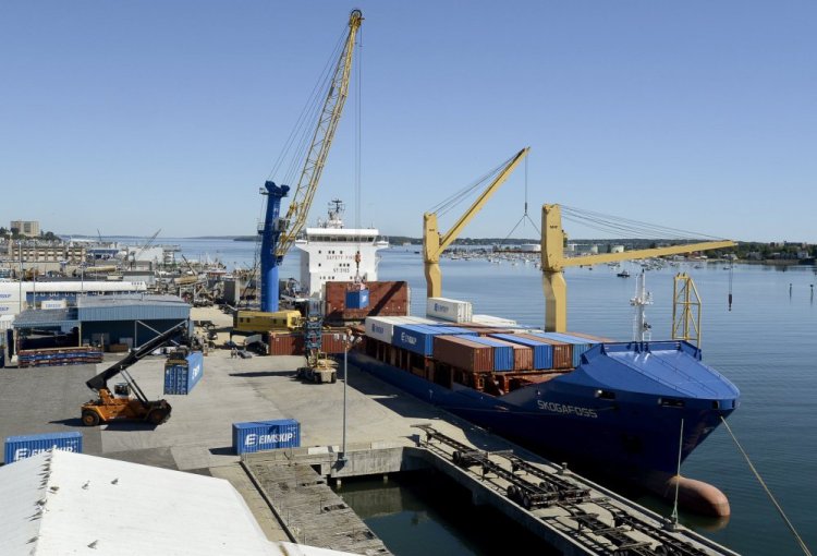 Eimskip loads containers on a ship at the International Marine Terminal in Portland. Planned upgrades at the port include the addition of a second mobile harbor crane.