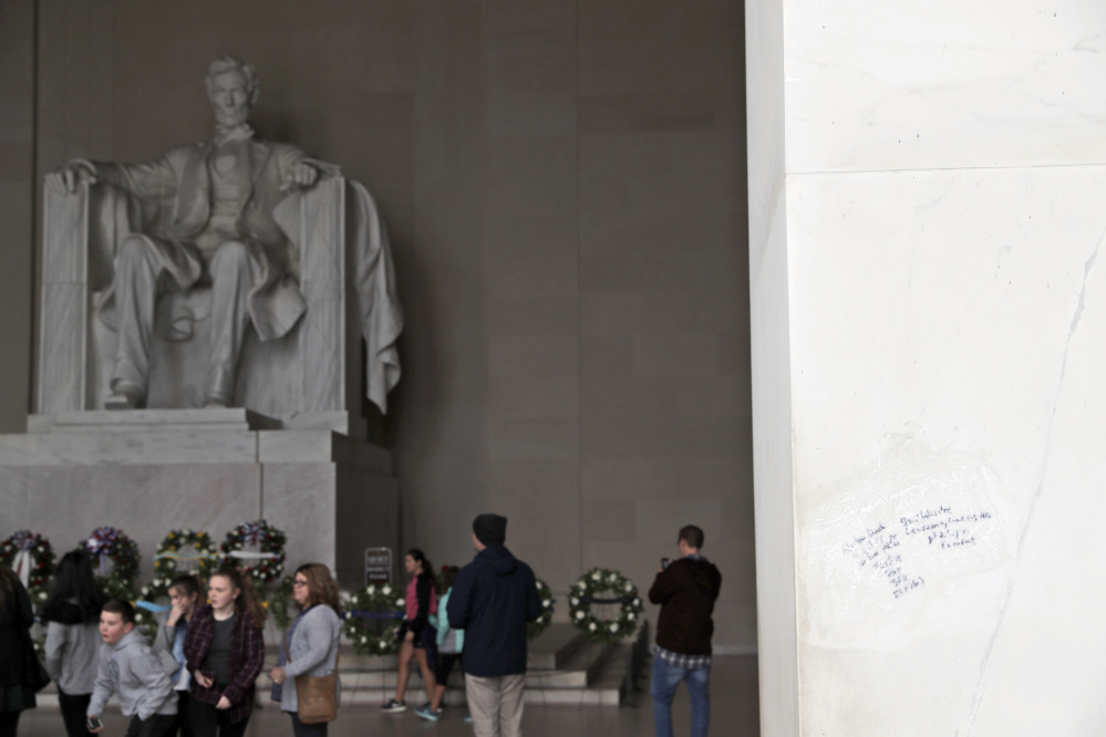 Graffiti is being removed from the Lincoln Memorial on Tuesday in Washington.