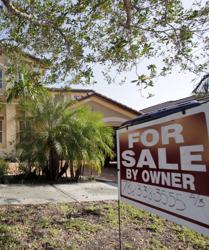 This Dec. 7, 2016 file photo shows a house for sale, in Hialeah, Fla.  Americans shrugged off rising mortgage rates and bought existing homes in January 2017 at the fastest pace since 2007. The National Association of Realtors on Wednesday, Feb. 22, 2017, says home sales rose 3.3 percent last months from December to a seasonally adjusted annual rate of 5.69 million. (AP File)