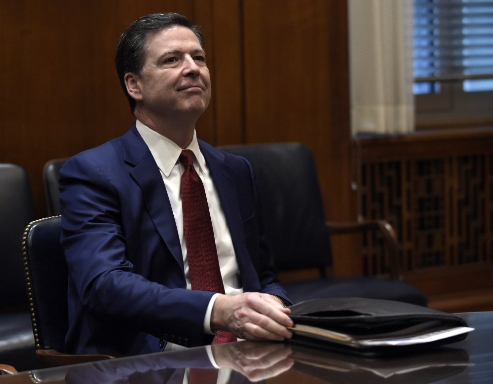 FBI Director James Comey faces political pressure from the White House to dispute reports about connections between the Trump administration and Russia.