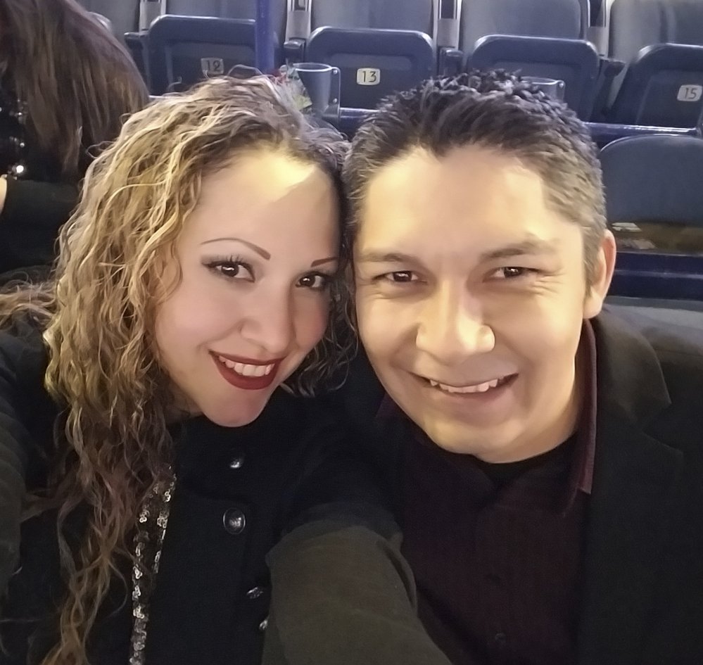 Elizabeth Hernandez, a U.S. citizen, poses with her husband, Juan Carlos Hernandez Pacheco, at a concert last year in Chicago.