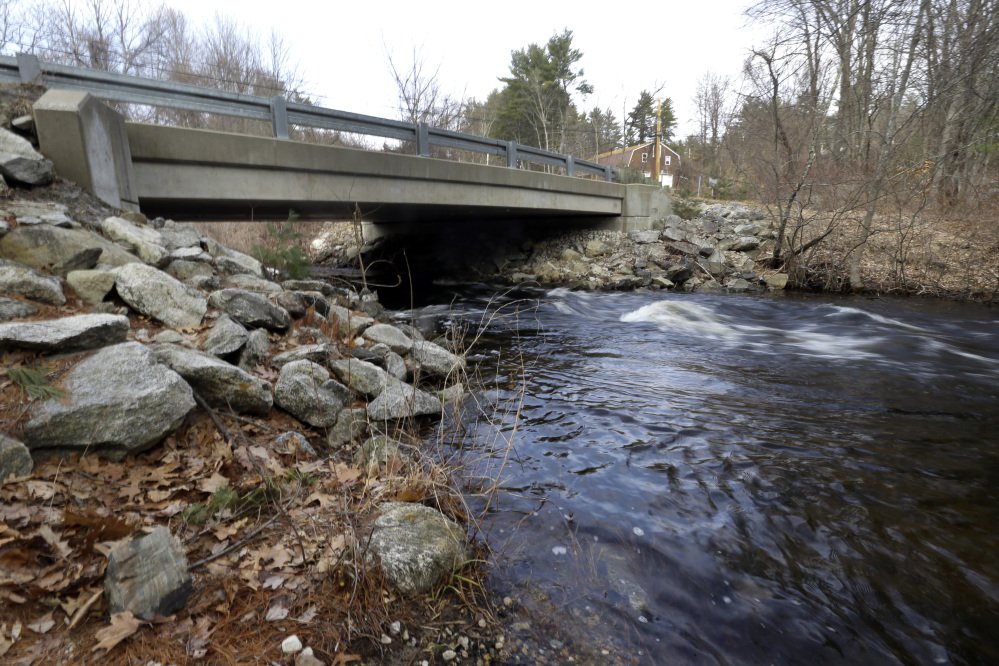 Beaver Brook flows under a bridge closed to traffic Tuesday in Pelham, N.H. Gov. Chris Sununu pledged to invest millions of dollars in repairing roads, bridges and schools in his budget address. Some 344 municipal bridges on the state's "red list."