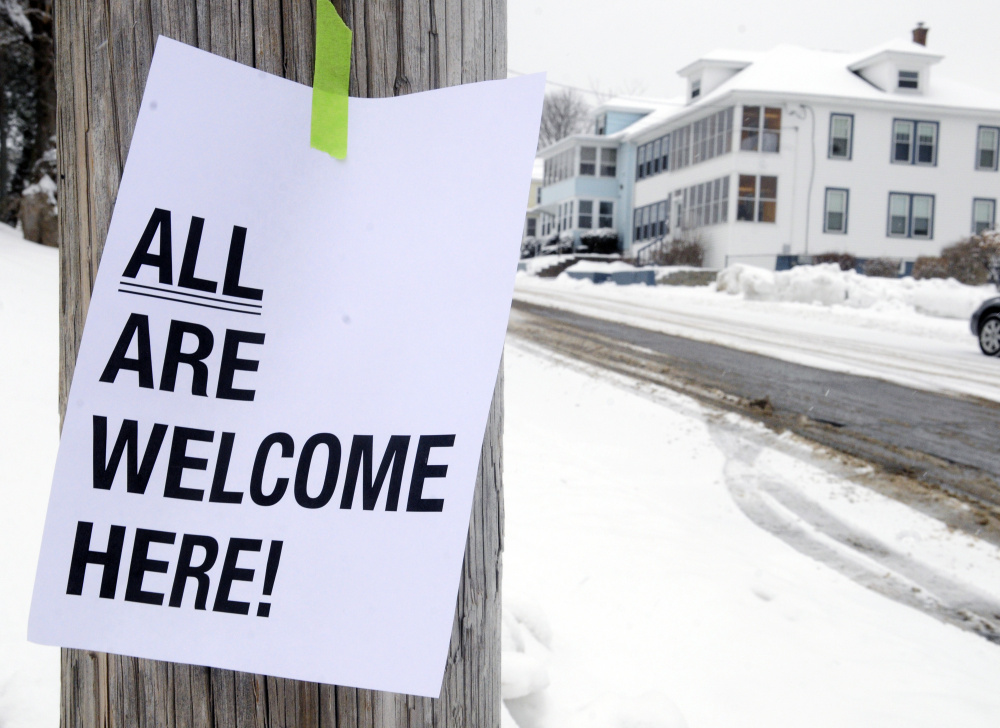 This sign hangs on a utility pole at corner of Oxford and Monroe streets on Wednesday in Augusta. The signs appeared after pro-Ku Klux Klan fliers were found around the Sand Hill neighborhood.